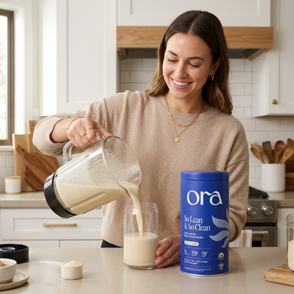 Adult woman preparing a shake with Ora protein powder